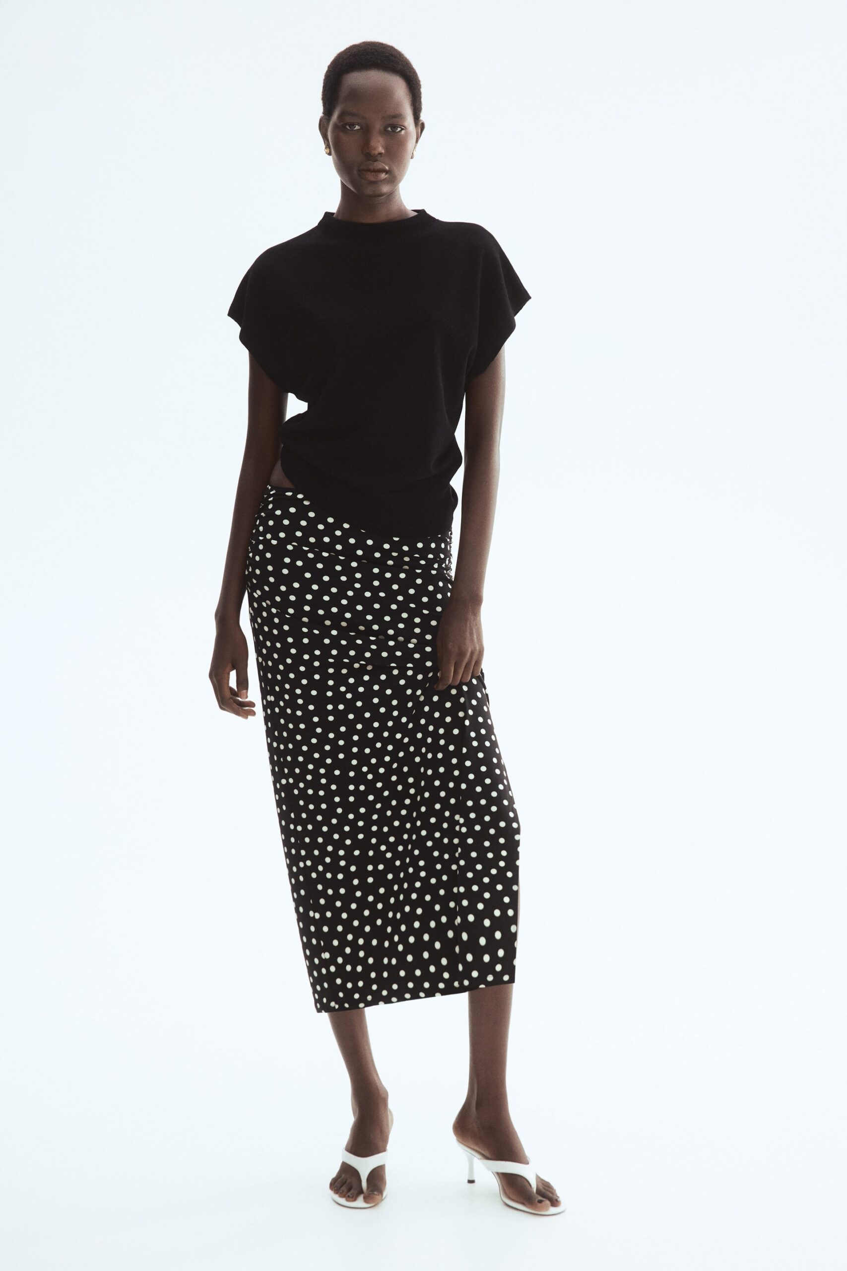 Black polka dot draped midi skirt AED 89