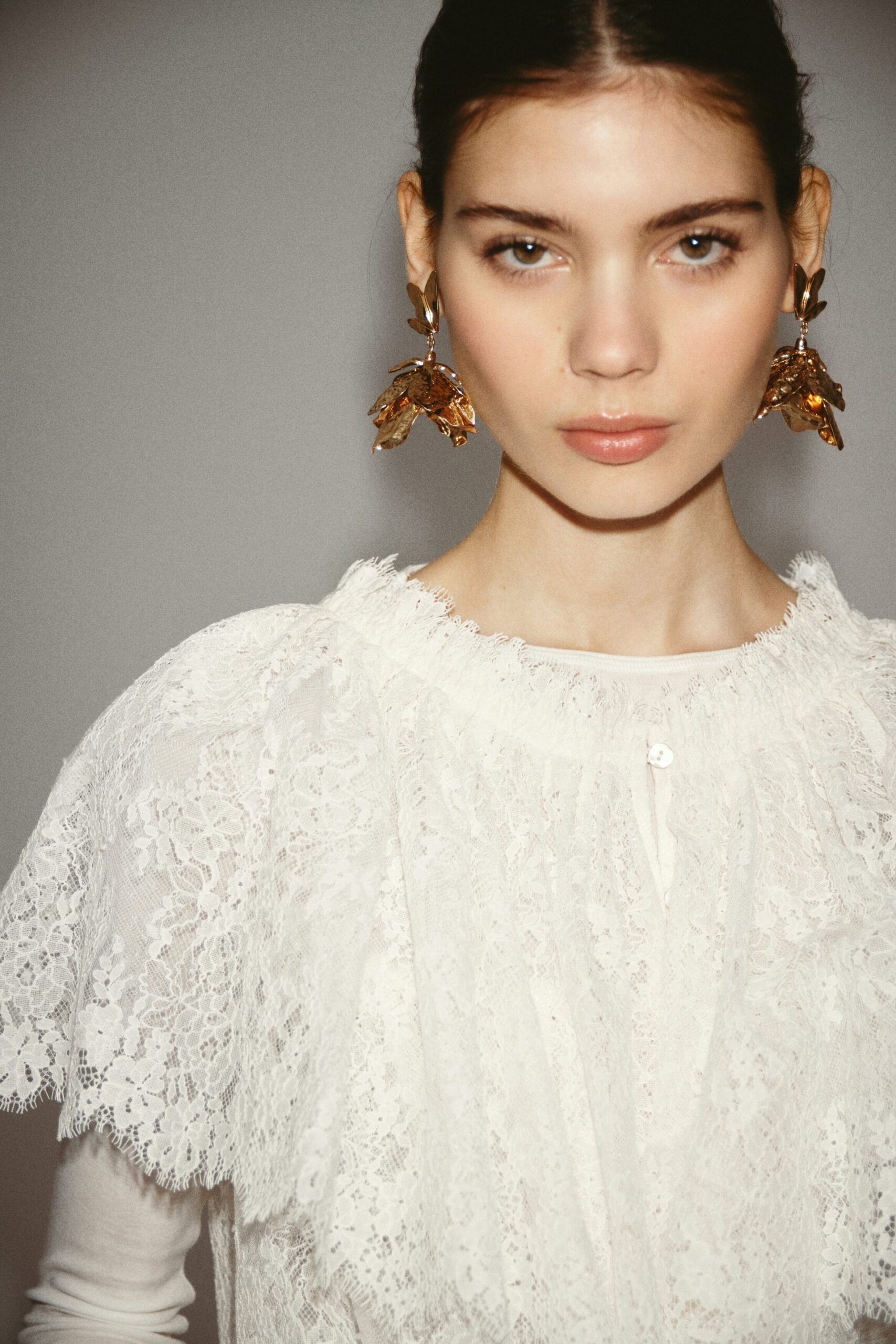 Gold-coloured pendant earrings AED 99