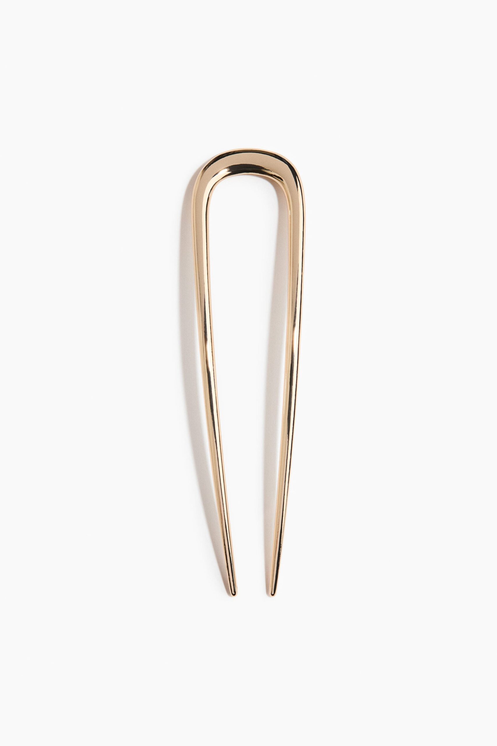 Gold-coloured hair pin H&M AED 20